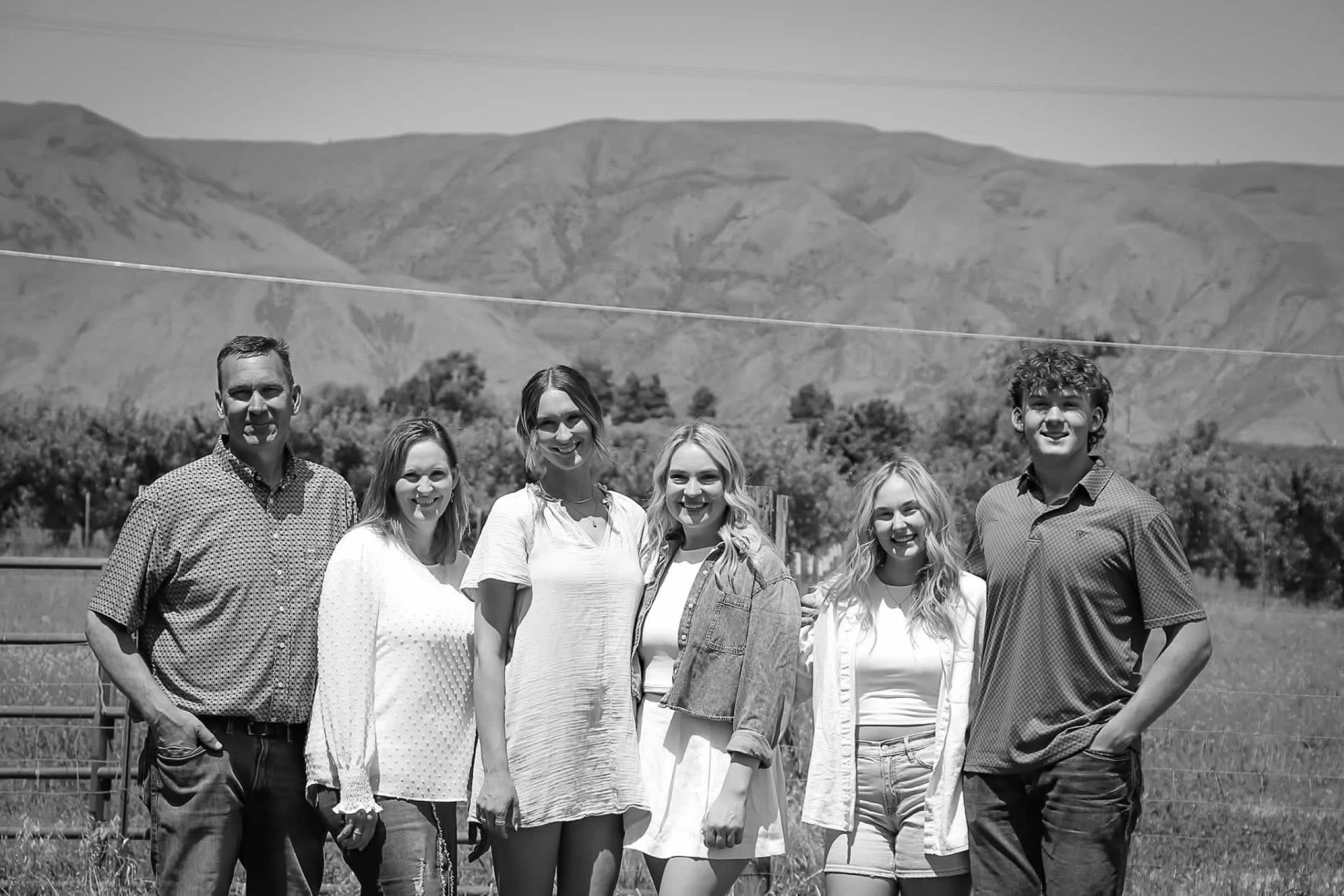 Lisa, Ryan, and their four kids together outdoors